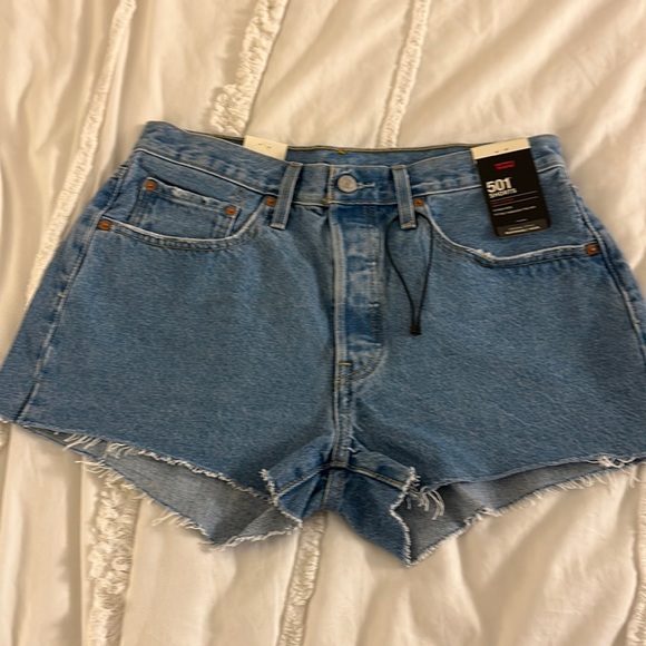 Levi's Pants - NWT Levi’s 501 denim shorts with raw hem. Size 30. Measurements in pics.